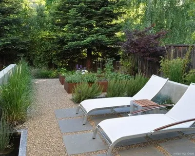 Backyard Patio With Surrounding Garden Beds