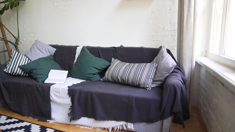Choose a Skirted Sofa to Hide Clutter Underneath